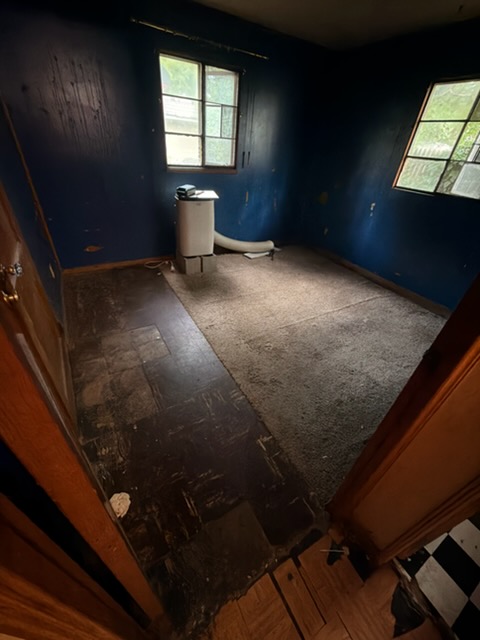 Bedroom stripped back to bare floor once the last load went out