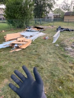 Scrap lumber and debris cleared from a back yard