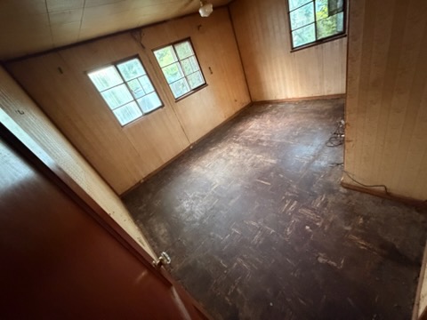 Empty bedroom swept clean after the last load went out