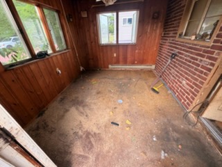Back porch emptied and swept after a hauling job